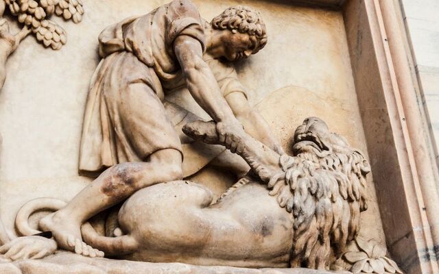 A sculpture of the facade of the Cathedral of Milan in Italy - \"Sansonde Kills the Lion.\"