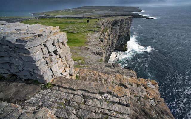 Stone walls along cliffs on Inishmore at Dun Aengus Fort in the Aran Islands.