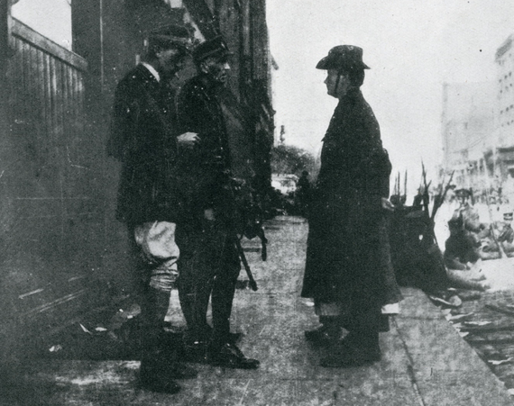 Standing directly behind Padraig Pearse, Elizabeth O'Farrell. Standing directly behind Padraig Pearse, Elizabeth O'Farrell.